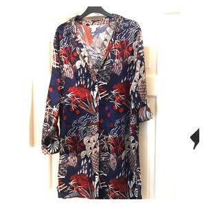 Blue, white and red patterned long shirt.